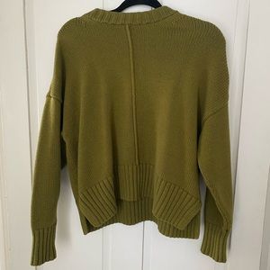 A New Day green sweater